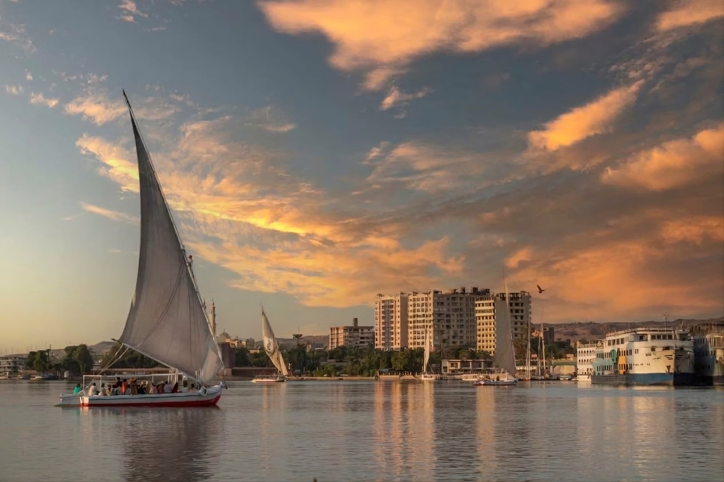 Traditional sailboat on the Nile at sunset